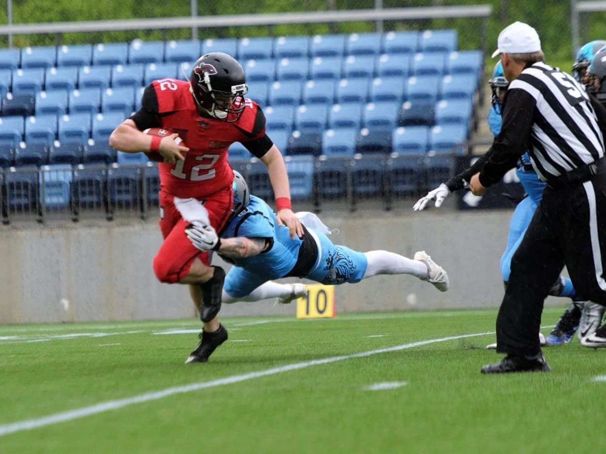 Monarchs defender making a diving tackle near the 10-yard line