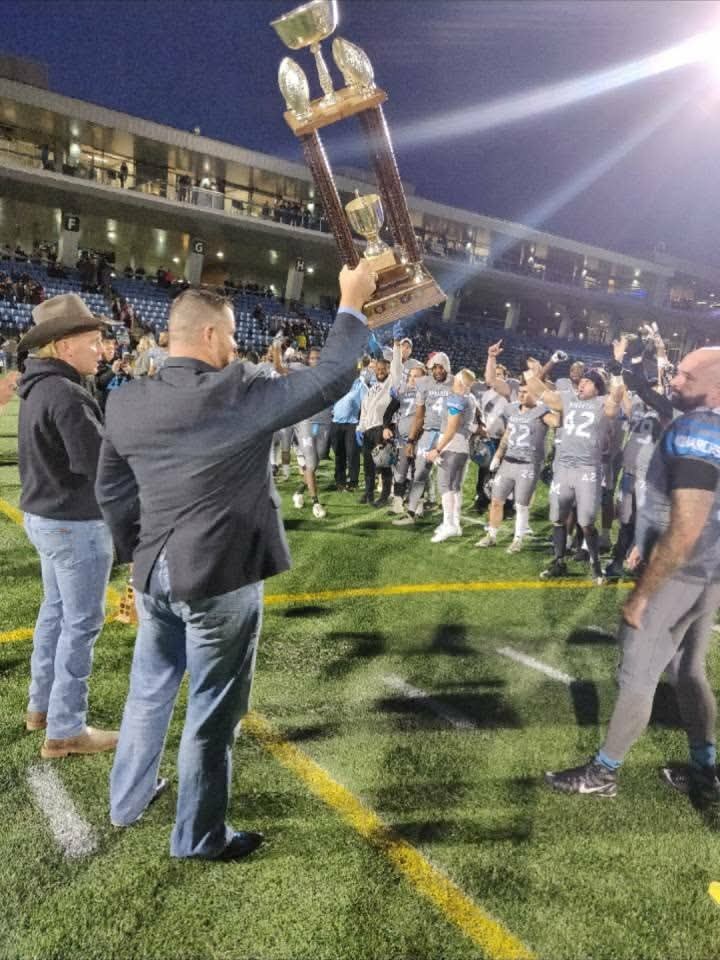 Championship trophy presentation at SMS Equipment Stadium under the lights