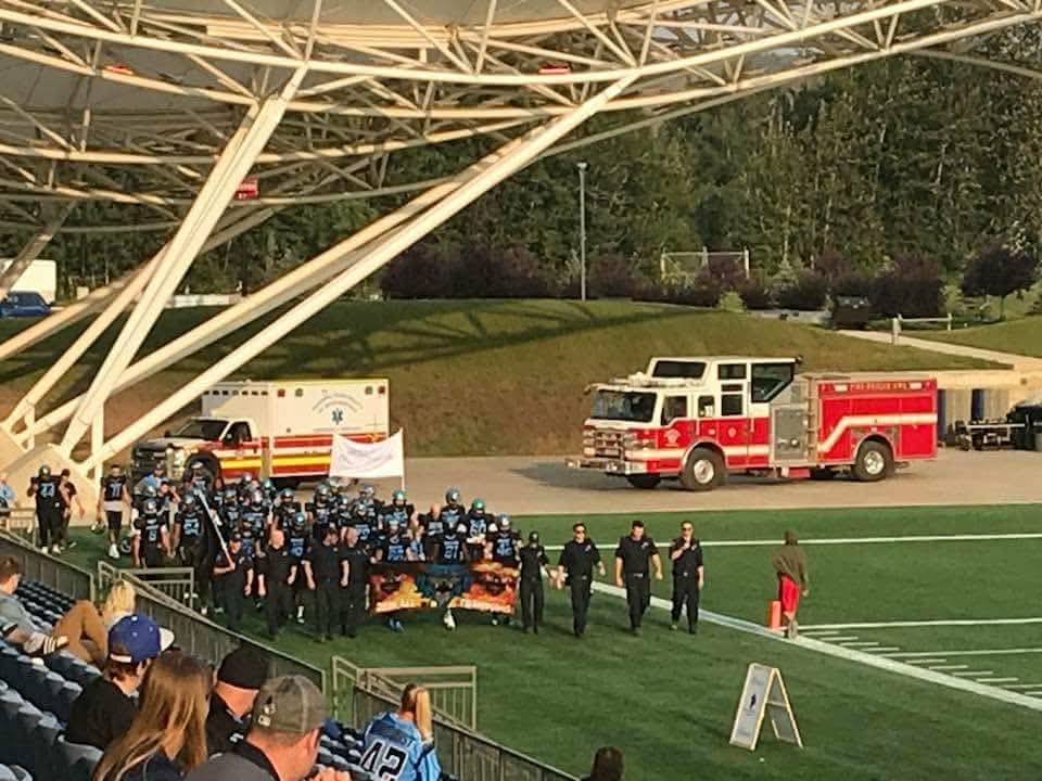 Monarchs team walking onto SMS Equipment Stadium on game day