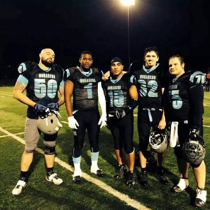 Monarchs players posing together after a night game